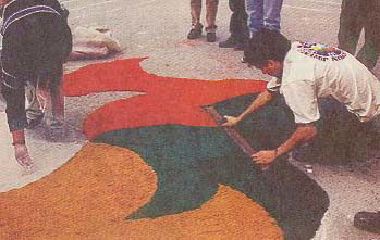Artisans making a colorful street carpet in Ayacucho